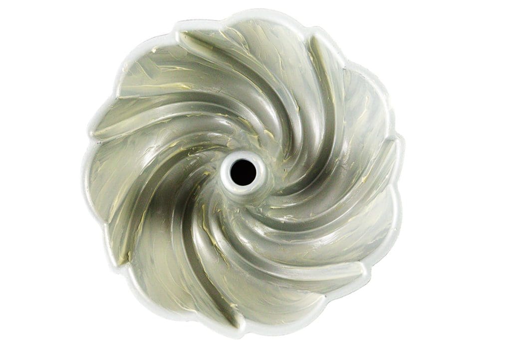 Top-down view of a bundt cake pan with a swirled, spiral design and a central tube, perfect for baking a classic Sock it to me cake, shown empty against a white background.