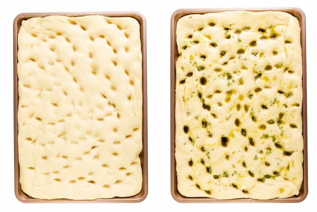 Two baking sheets with focaccia dough: the left has plain dough with finger dimples, while the right features Garlic Focaccia topped with herbs, olive oil, and a sprinkle of Parmesan—ready to bake.