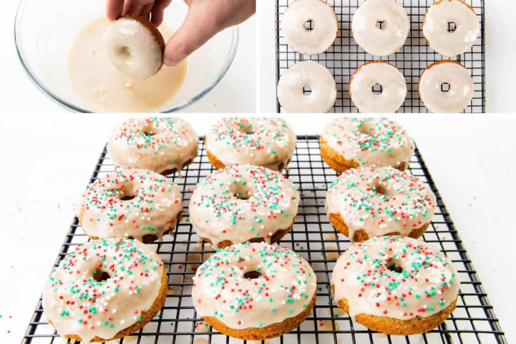 A hand dips a baked donut into white glaze; six glazed gingerbread donuts cool on a rack; below, nine donuts with white glaze and red and green sprinkles rest on a wire rack.