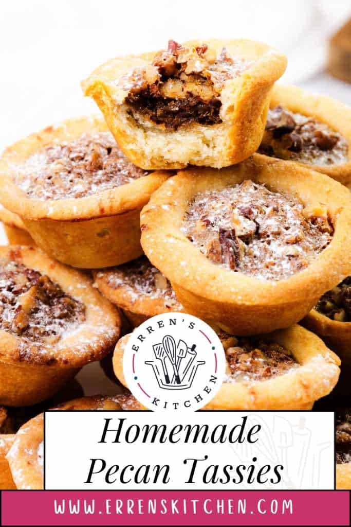 A close-up of homemade Southern Pecan Tassies, one with a bite taken out to reveal the rich filling. A label reads “Homemade Pecan Tassies” with the Erren’s Kitchen logo and website at the bottom.