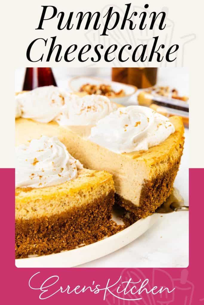 A Pumpkin Spice Cheesecake with a graham cracker crust is topped with whipped cream. A large slice is being lifted out. Text reads "Pumpkin Cheesecake" at the top and "Erren's Kitchen" at the bottom.