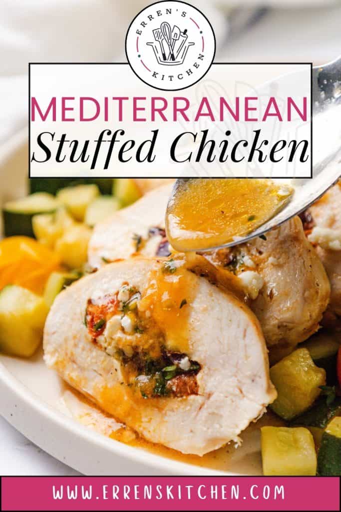 Close-up of Mediterranean Stuffed Chicken on a plate with vegetables, topped with sauce being poured over it. The chicken is sliced to reveal the colorful Mediterranean stuffing inside. Text on image reads “Mediterranean Stuffed Chicken.”.