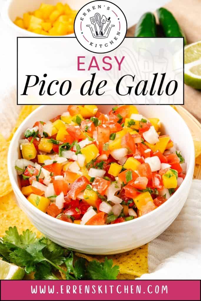 A bowl of colorful Pico de Gallo salsa made with tomatoes, onions, and peppers sits on a table with tortilla chips, fresh cilantro, lime, and jalapeños. Text on the image reads, "Easy Pico de Gallo" and "www.errenskitchen.com.