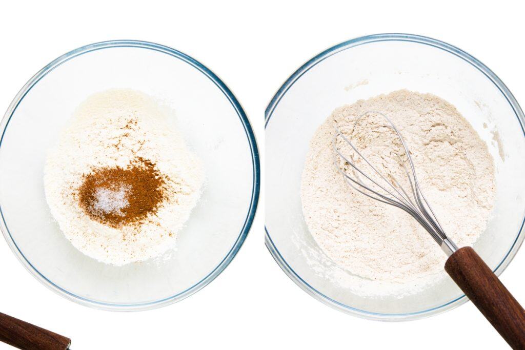 Two glass bowls seen from above: one holds flour, cinnamon, and a pinch of salt for Tres Leches Cake; the other displays the ingredients whisked together with a metal whisk featuring a wooden handle.