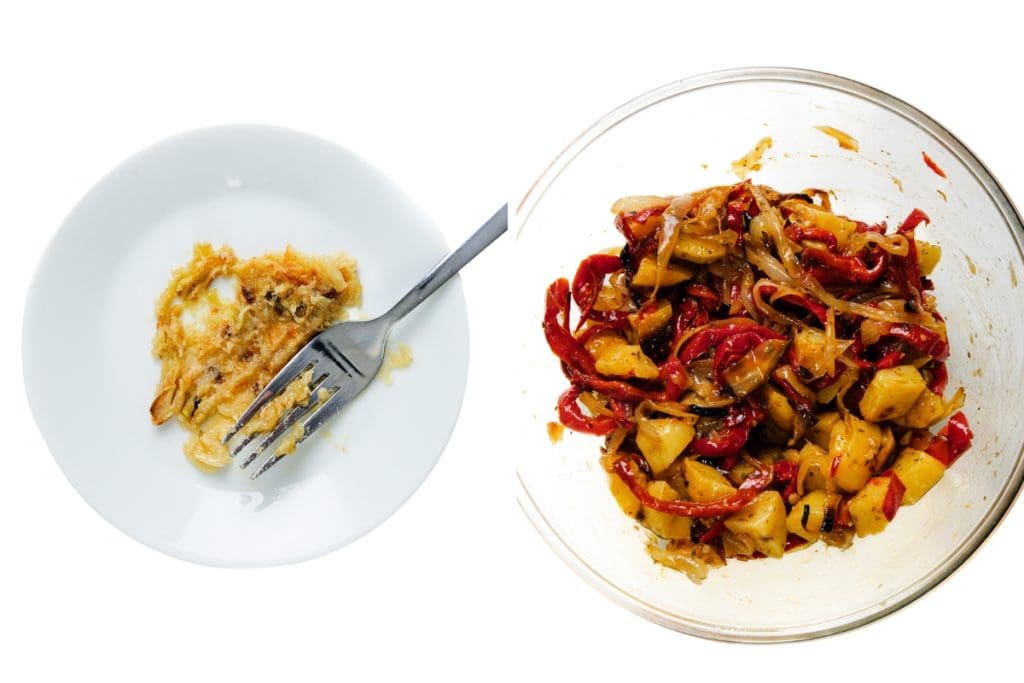 A white plate with a small portion of food and a fork is on the left, while a glass bowl with mixed sautéed vegetables—reminiscent of classic Italian Hot Dogs and Italian street food—is on the right, against a white background.