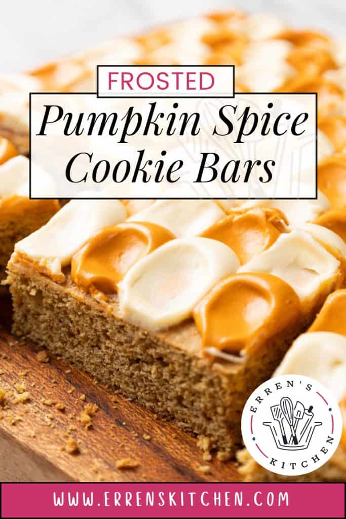 Frosted Pumpkin Spice Cookie Bars topped with dollops of white and orange frosting.